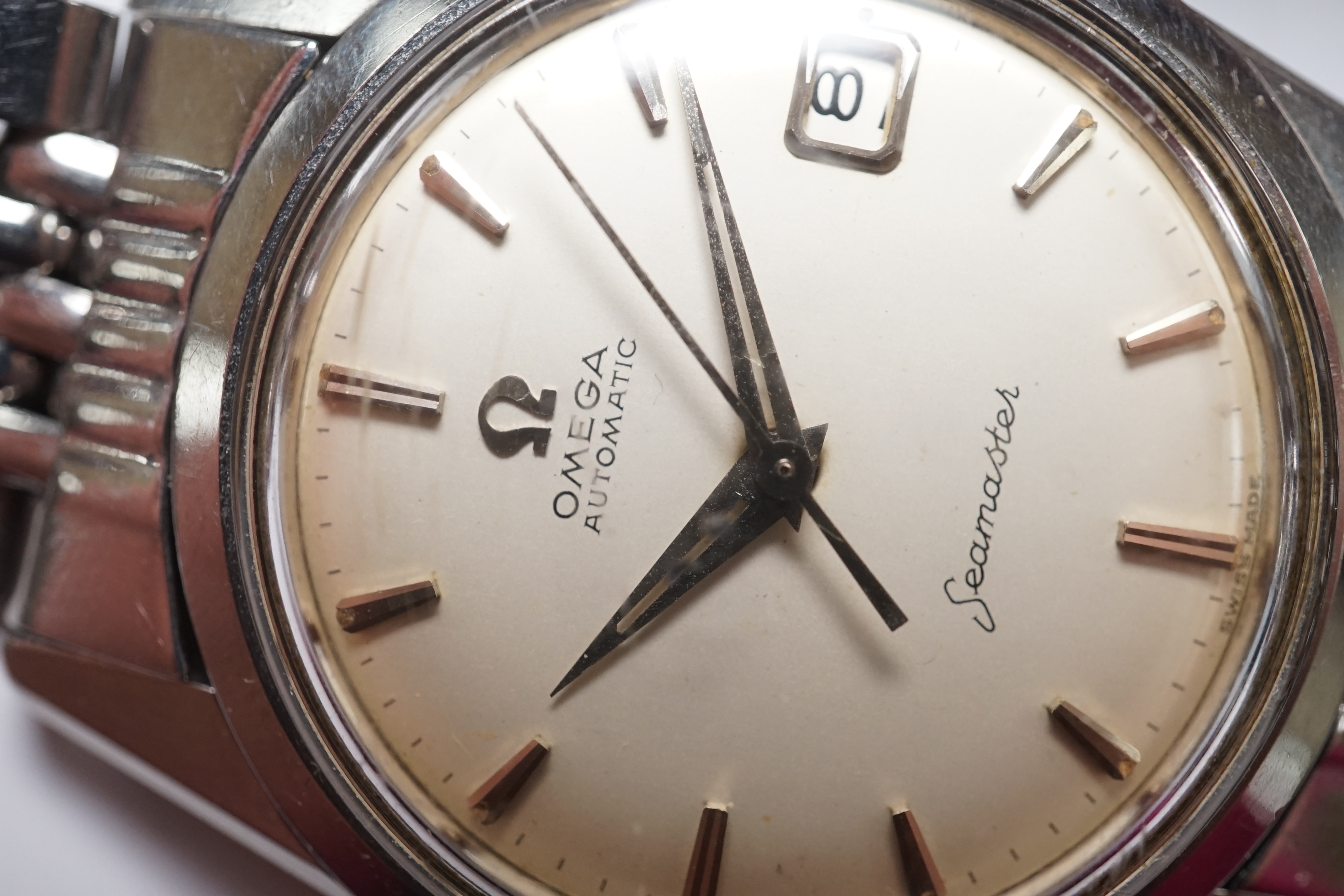 A gentleman's 1960's? stainless steel Omega Seamaster Automatic wrist watch, with baton numerals and date aperture, case diameter 35mm, no box or papers. Condition - poor to fair